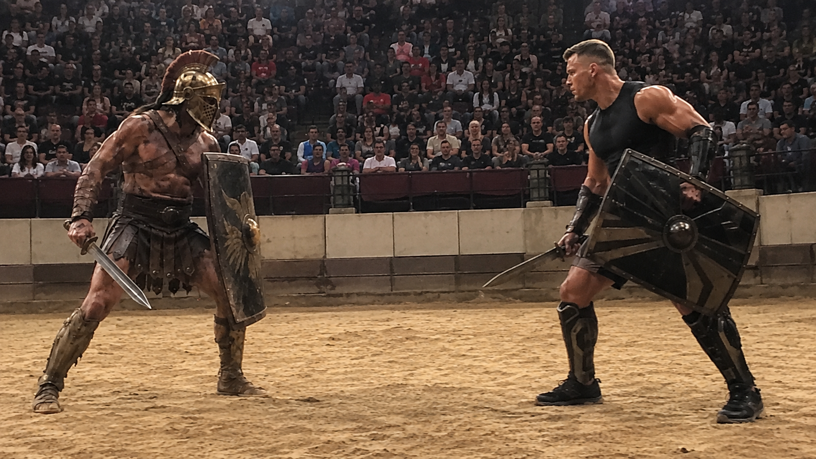 An ancient Roman gladiator faces a modern sports-science-trained fighter in a contemporary arena.